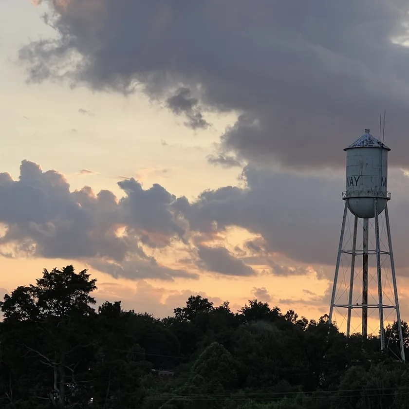 Midway Music Melodeon show art featuring the Midway water tower against a sunset sky.